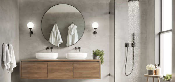 modern bathroom design featuring double sinks round mirror luxurious towels and a sleek shower showcasing 14 design elements for comfort and style