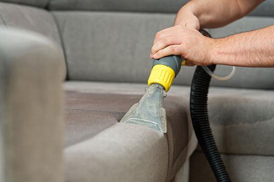 Hover cleaning upholstered sofa